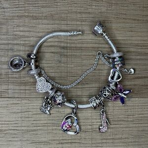 Pandora Bracelet Silver 925 Ale. With assorted charms + original Pandora bag.